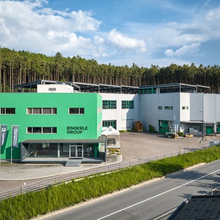 The headquarters in Italy consists of a production hall and an office building.