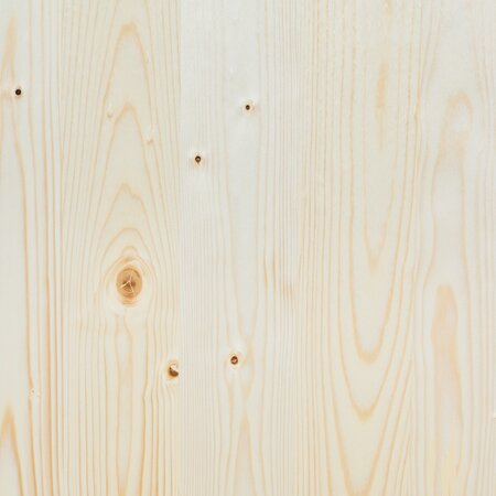 The wooden top of the beer garden table sets in nature.