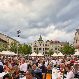 At the Dine, Wine & Music event, many beer garden table sets were set up so that people could enjoy the wine and food there.